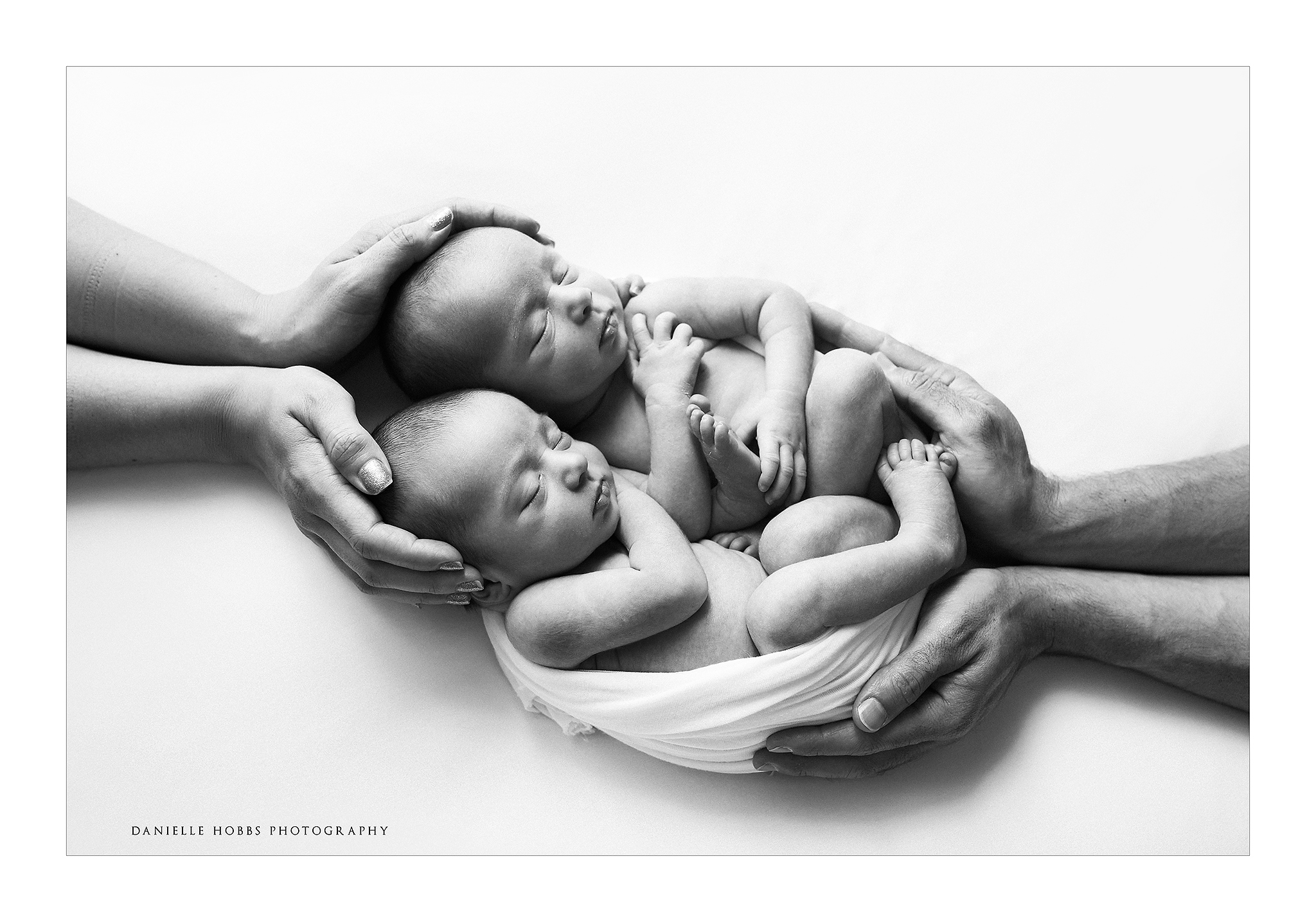 Twin newborns in parents hands Washington DC