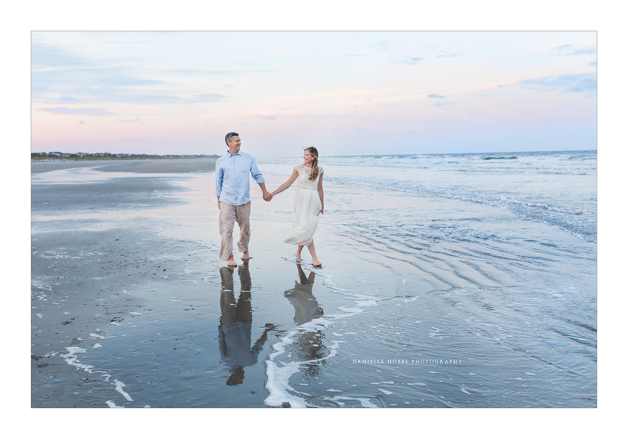 Married couple on the beach at sunset