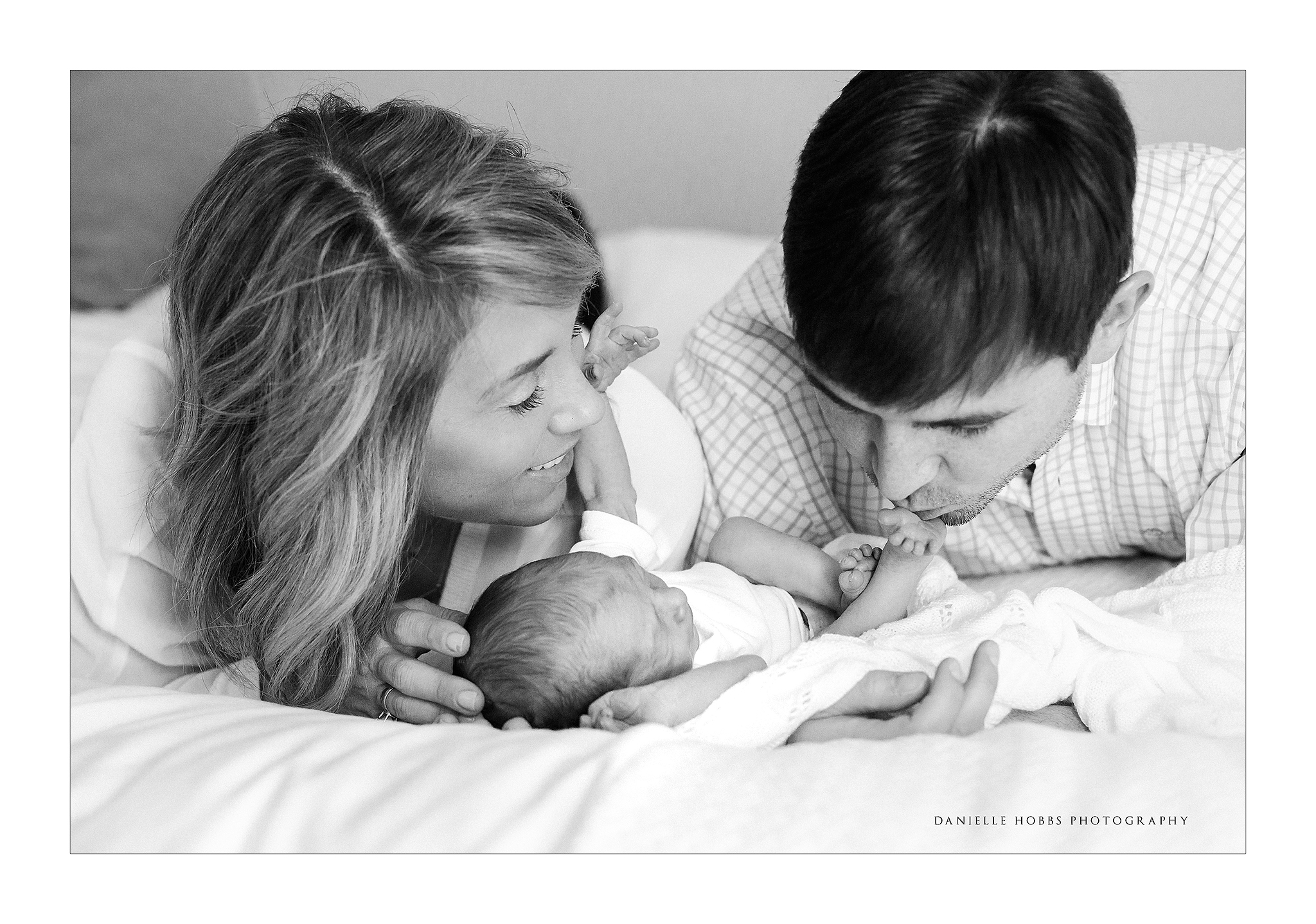 Dad kissing baby toes DC Newborn