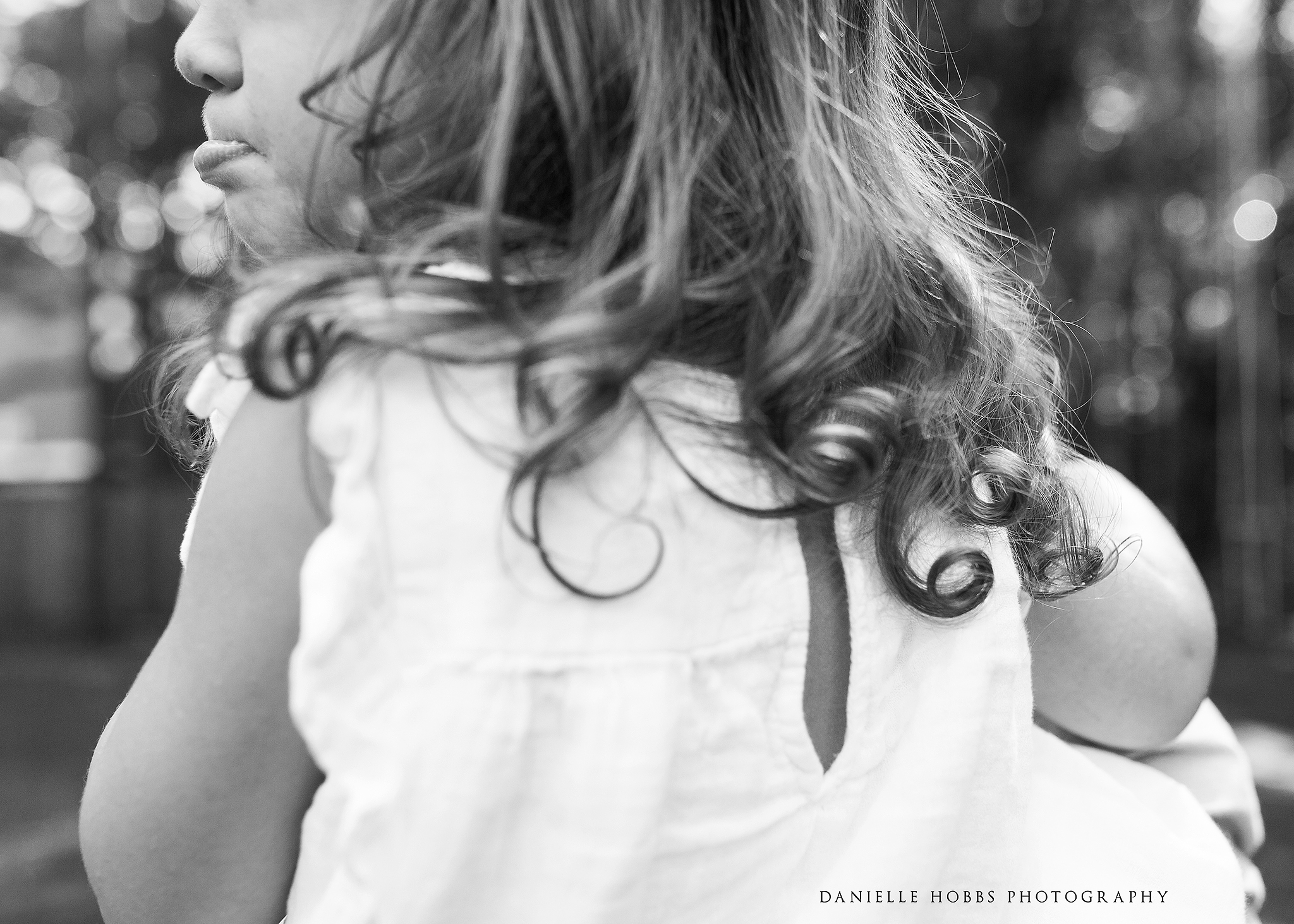 Toddler curls and pouty lip black and white family photography