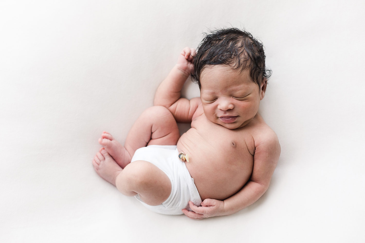 curled sleeping newborn northern virginia photographer