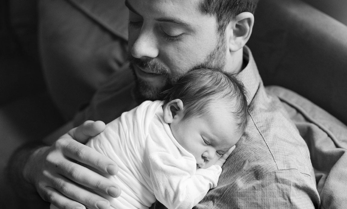 dad holding baby black and white photo washington dc newborn photos