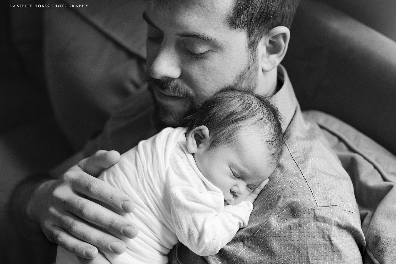 dad holding baby black and white photo washington dc newborn photos